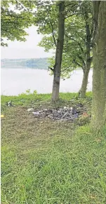  ??  ?? Fires have been lit and litter left discarded at Loch Fitty with many items tossed into the water itself.