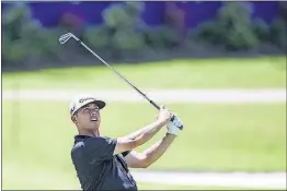  ?? [BRAD VEST/THE COMMERCIAL APPEAL VIA AP] ?? Chez Reavie takes his second shot on the 18th hole during the second round of the St. Jude Classic on Friday at TPC Southwind in Memphis, Tenn.