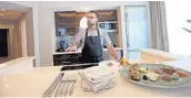  ?? AMY BETH BENNETT/STAFF PHOTOGRAPH­ER ?? Executive Chef Jorge Ramos shows off one of the guest suites at Conrad Fort Lauderdale Beach Resort.