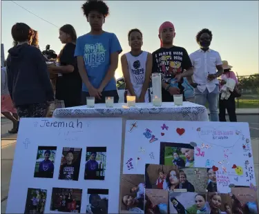  ?? EVAN BRANDT — MEDIANEWS GROUP ?? At center, from left, Aiden Coles, 11, Coney Brown, 11and Staten Brown, 12, with the picture boards they made in memory of their friends who died.