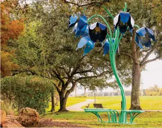  ?? Photos by city of Sugar Land ?? Inspired by the bluebell plant, “Blue Bells” by artist Richard Herzog stands as functional art pieces — benches on which visitors can sit and enjoy Oyster Creek Park.