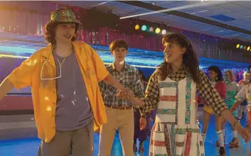  ?? COURTESY OF NETFLIX ?? From left, Finn Wolfhard as Mike Wheeler, Noah Schnapp as Will Byers and Millie Bobby Brown as Eleven in “Stranger Things.” The fourth season filmed in and around Albuquerqu­e, including at Roller King and Eldorado High School.