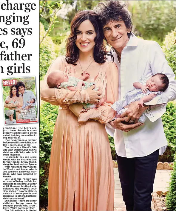  ??  ?? Proud parents: Sally and Ronnie Wood cradle their twin daughters, Gracie Jane and Alice Rose, in their arms