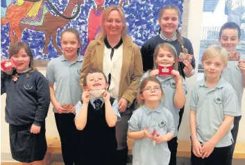  ??  ?? Bookworms Dr Lisa Cameron MP with prize winners Flossie Hay, Caitlin Mackinnon, Louie Galgani, Caitlyn Doak, Caragh Campbell, Hannah Smith, Ruaridh Hay and Leon Galgani