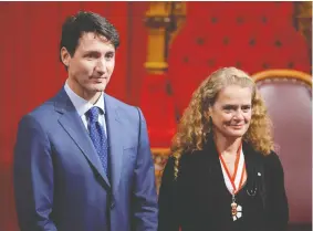  ?? ADRIAN WYLD / THE CANADIAN PRESS ?? Julie Payette stands alongside Prime Minister Justin Trudeau in the Senate chamber during her installati­on as Governor General in 2017.