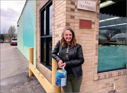  ?? PHOTOS BY GINA JOSEPH — THE MACOMB DAILY ?? Sterling Heights illustrato­r Wendy Popko stands in front of Ventimigli­a’s Italian Foods, a grocery store and deli where she will be creating the city’s first augmented reality mural on the wall outside.