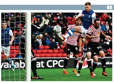  ?? BPI ?? Too easy: Tom Lees rises unopposed to head home Sheffield Wednesday’s second goal