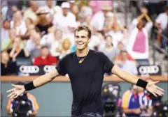  ?? CLIVE BRUNSKILL/GETTY IMAGES/AFP ?? Vasek Pospisil celebrates match point against Andy Murray at Indian Wells Tennis Garden on Saturday.