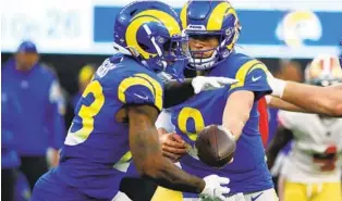  ?? KATELYN MULCAHY GETTY IMAGES ?? Rams’ Cam Akers, taking ball from Matthew Stafford, has returned from injury ahead of schedule.