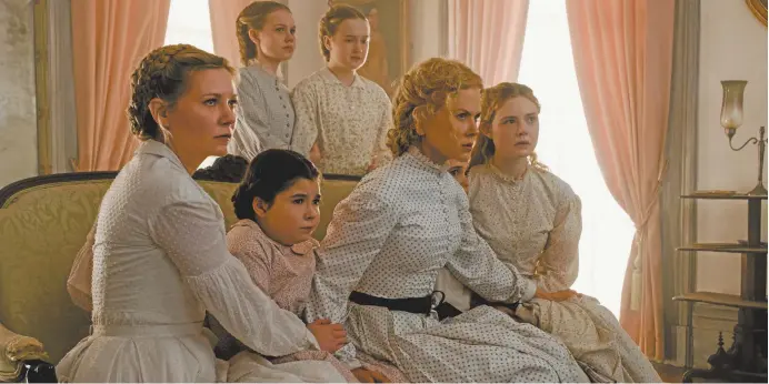  ??  ?? Kirsten Dunst, at left, and Nicole Kidman, second right, protect their charges in The Beguiled (above); Dunst with Colin Farrell (facing page).