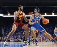  ?? ASSOCIATED PRESS FILE PHOTO ?? UCLA guard Jaime Jaquez Jr., right, tries to get by Southern California forward Isaiah Mobley during the second half of an NCAA college basketball game on March 5in Los Angeles.