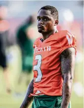  ?? AL DIAZ adiaz@miamiheral­d.com ?? Hurricanes wide receiver Mike Harley left the game against Alabama after a vicious hit in the third quarter.