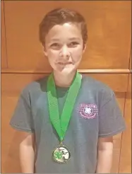  ??  ?? Gordon County 4-H’er Sawyer Derrick receiving his individual award at the Target Challenge Weekend of the state BB rifle match.