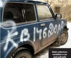  ??  ?? Debt collectors vandalize a car and wall with the warning, “Apartment 146Debtor”