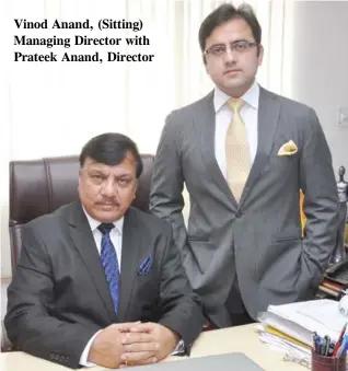 ??  ?? Vinod Anand, (Sitting) Managing Director with Prateek Anand, Director