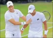  ?? AP ?? Marcus Willis (L) and Jay Clarke celebrate winning their doubles match in London on Wednesday.