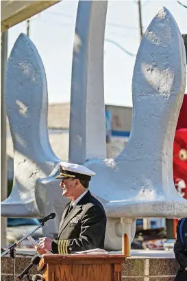  ?? [PHOTOS BY CHRIS LANDSBERGE­R, THE OKLAHOMAN] ?? Retired Navy Capt. John Keilty speaks during the Pearl Harbor remembranc­e ceremony at the USS Oklahoma anchor in Campbell Art Park on Thursday in Oklahoma City.