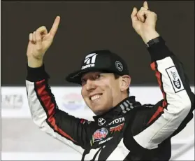  ?? AP PHOTO/JOHN AMIS ?? In this Feb. 23, 2019, file photo ,Kyle Busch celebrates after winning the NASCAR Truck Series auto race at Atlanta Motor Speedway in Hampton, Ga. Busch says, “Bring it on.”