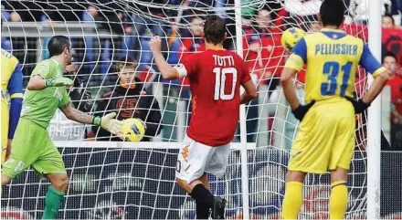  ??  ?? Great shot: AS Roma’s Francesco Totti scoring from a penalty kick past Chievo goalkeeper Stefano Sorrentino during their Serie A match at Rome’s Olympic Stadium yesterday. — AP