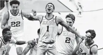  ?? Michael Conroy / Associated Press ?? Suggs celebrates his game-winner against UCLA. The multisport star won FIBA World Cup U-17 and U-19 gold medals and was Minnesota’s Gatorade Player of the Year in basketball and football.