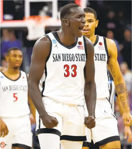  ?? K.C. ALFRED U-T ?? Aztecs’ Aguek Arop, celebratin­g their first-round win, is one reason opposing coaches talk about this team’s physicalit­y.