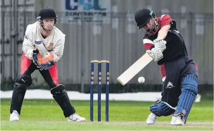  ?? PHOTO GREGOR RICHARDSON ?? Having a heave . . . Carisbrook­Dunedin opener Camden Hawkins launches into a big shot at Tonga Park on Saturday. Albion wicketkeep­er Tim Ford watches on.