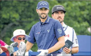  ?? CP PHOTO ?? Adam Hadwin of Abbotsford B.C. discusses club selection on the 17th Tee with caddie Joe Cruz during the 2017 Canadian Open Pro-Am in Oakville, Ont., on Wednesday.