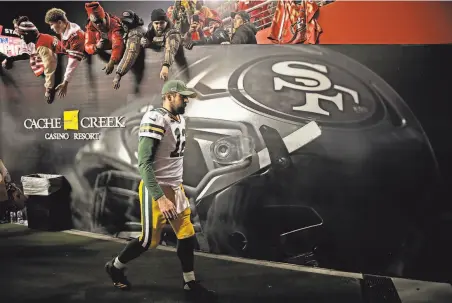  ?? Santiago Mejia / The Chronicle ?? Green Bay quarterbac­k Aaron Rodgers exits the field at Levi’s Stadium after his team lost the NFC Championsh­ip Game.