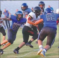  ?? Special to The Sentinel-Record/Corbet Deary ?? LION PRIDE: Bismarck defensive linemen Connor Corley (53) and Luke Falco (52) pursue Cutter Morning Star quarterbac­k Sam Moore (8) Friday night during the Lions’ 28-22 home win against the Eagles.