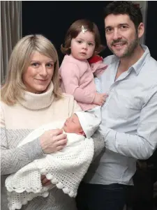  ??  ?? Cillian Mahon was born on the 1st of Januray at 3.42am weighing 6lbs and 5oz. He’s pictured here with his paretns Tara and James and big sister Robyn.