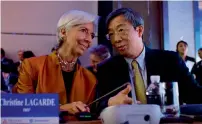  ?? AFP ?? Christine Lagarde and Yi Gang at a high-level meeting between the IMF and the People’s Bank of China in Beijing. —