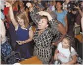  ?? HERALD PHOTO, ABOVE, BY JIM MICHAUD; STAFF PHOTOS BY NICOLAUS CZARNECKI, LEFT, AND NANCY LANE, BELOW ?? WOMEN TO CONTEND WITH: Rachael Rollins, above, celebrates election results. Ayanna Pressley, left, addresses supporters after securing the Dem nomination. Lori Trahan, below, waves a day before a close race with Dan Koh.