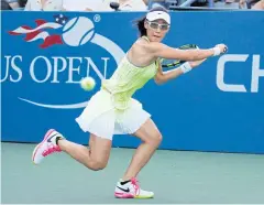  ?? EPA ?? Zheng Saisai hits a return to Monica Puig during their first-round match.