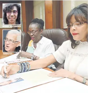  ?? LIONEL ROOKWOOD/PHOTOGRAPH­ER ?? MAMBY ALEXANDER THWAITES Rowena ‘Christene’ King (left) and Yulit Gordon, two of our Guest Editors, examine the plans before giving their final nod of approval to the special edition of tomorrow’s Gleaner observing Breast Cancer Awareness Month, on...