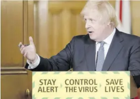  ?? (Photo: AFP) ?? This handout image released by 10 Downing Street shows Britain’s Prime Minister Boris Johnson speaking during a remote press conference to update the nation on the novel coronaviru­s COVID-19 pandemic in central London, yesterday.