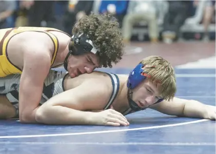  ?? MORNING CALL ?? Abington Heights’ Caleb Marzolino, bottom, will be looking to come out on top at the Class 3A Northeast Regional tournament at 189 pounds after finishing second last year at 172.