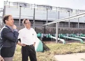  ?? Brett Coomer / Houston Chronicle ?? Adam Schiller, left,
and Peter Merwin take a look at the former Texas Instrument­s
campus last week in Stafford. Dallas-based
developer StreetLeve­l Investment­s
purchased the 192-acre TI campus and is moving
forward with plans to redevelop the
site.