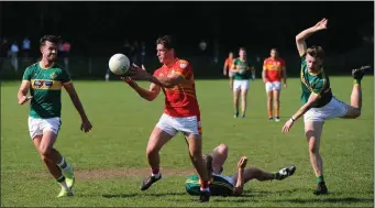  ??  ?? Colm O’Callaghan, Éire Óg releases the ball after evading the challenge of Alan O’Callaghan, St Michaels in the Bon Secours Cork Senior A Championsh­ip at Ballyanly Photo by George Hatchell