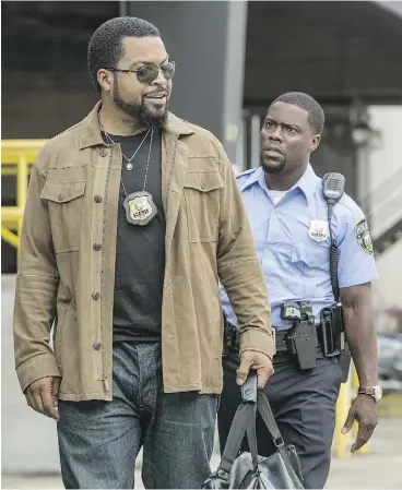  ?? QUANTRELL D. COLBERT / UNIVERSAL PICTURES VIA THE ASSOCIATED PRESS ?? Ice Cube, left, as James Payton and Kevin Hart as Ben Barber in Ride Along 2. The
movie offers a hint of fun throughout, but it dies every time Ice Cube frowns.