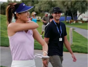  ?? The Associated Press ?? Michelle Wie, left, walks off the ninth green with Jonnie West during the April 4, 2019, first round of the LPGA Tour ANA Inspiratio­n at Mission Hills Country Club in Rancho Mirage, Calif. New mom Wie West is looking forward to being nervous again on the golf course. It’s been nearly two years since Wie West last played a competitiv­e round on the LPGA Tour, and nine months since she gave birth to daughter Makenna.
