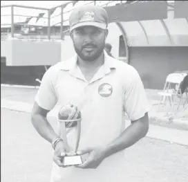  ??  ?? Veerasammy Permaul poses with his accolade presented to him by the Guyana Cricket Board for his services (Romario Samaroo photo)