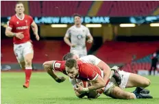  ?? AP ?? Liam Williams scores Wales’ second try in their win over England in Cardiff.