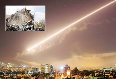  ?? (AP/AFP) ?? Damascus skies erupt with surface to air missile fire as the US launches an attack on Syria targeting different parts of the Syrian capital Damascus, Syria, early April 14. Syria’s capital has been rocked by loud explosions that lit up the sky with...