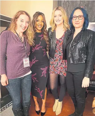  ?? KAREN KOSOWSKI PHOTO ?? Grammy-nominated singer-songwriter Mickey Guyton, second from left, is flanked by her Torontoare­a writers, Victoria Banks, left, Emma-Lee and Karen Kosowski at Nashville’s Ryman Theatre.