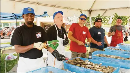  ?? Amy K. Thornton / Contribute­d photo ?? The Milford Oyster Festival will be held on Aug. 20. Above, a crew prepares oysters for an earlier festival.