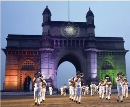  ?? — PTI ?? Navy personnel rehearse for the Beating Retreat and Tattoo Ceremony for the Navy Day celebratio­n at the historical Gateway of India in Mumbai on Sunday.