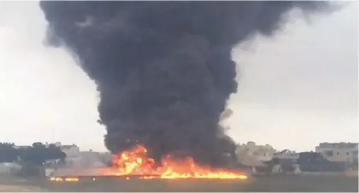  ??  ?? AFTERMATH: A huge plume of black smoke rises over Malta Internatio­nal Airport after a light aircraft crashed to the ground