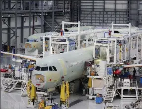  ?? (Bloomberg News/Luke Sharrett) ?? An Airbus A321 plane fuselages sit on the production floor at the company’s final assembly line facility in Mobile, Ala., in this 2017 file photo.
