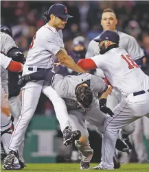  ?? ASSOCIATED PRESS FILE PHOTO ?? Boston Red Sox and New York Yankees players fight during an April 11 game at Fenway Park in Boston. The bitter rivals, possessing the top two records in the league, meet again Tuesday at Yankee Stadium in New York.