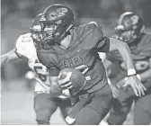  ?? CHERYL EVANS/THE REPUBLIC ?? Perry quarterbac­k Chubba Purdy (12) carries the ball during a football game against Basha at Perry High School on Friday.